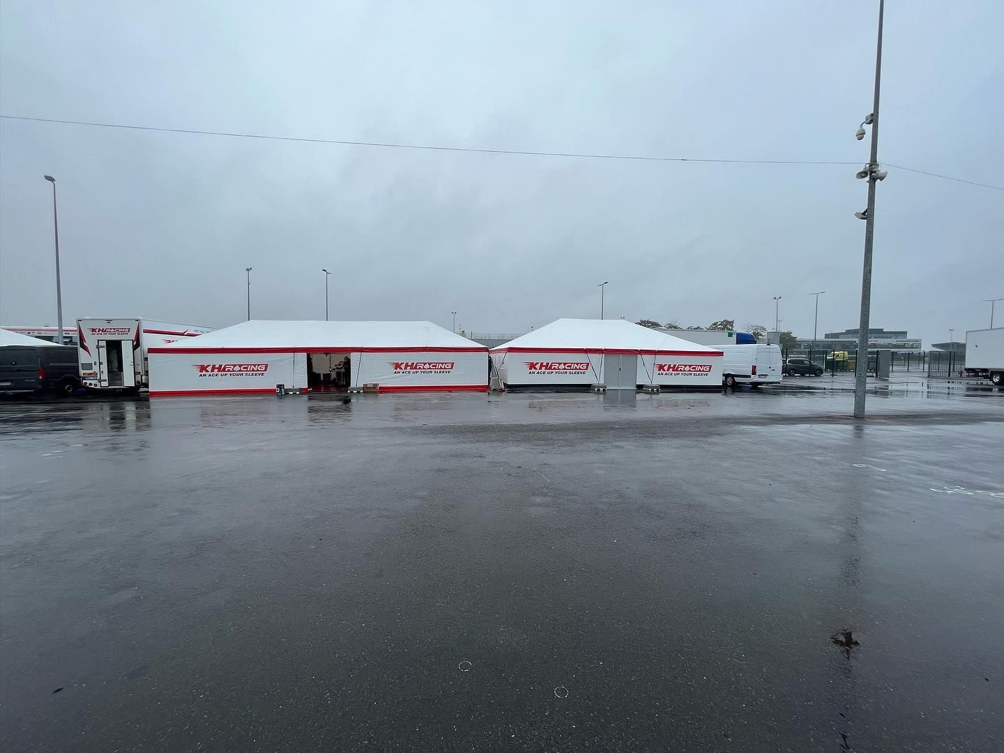 Two awnings with the KH Racing logo in the paddock at the IAME World Finals in Le Mans