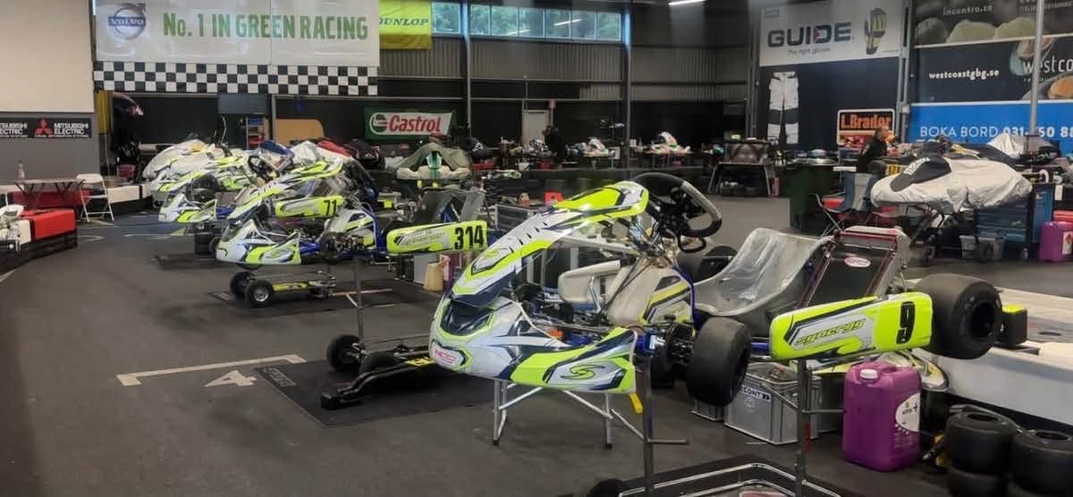 Synergy karts on stands in the indoor paddock hall at Göteborg Karting Ring