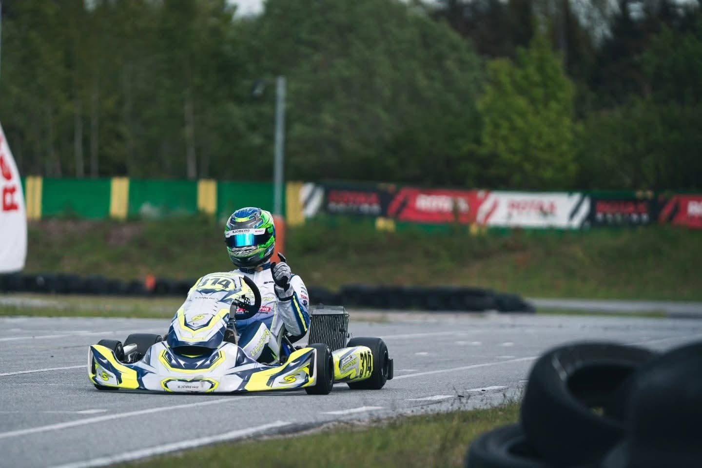 Synergy kart number 414 coming out of a corner
