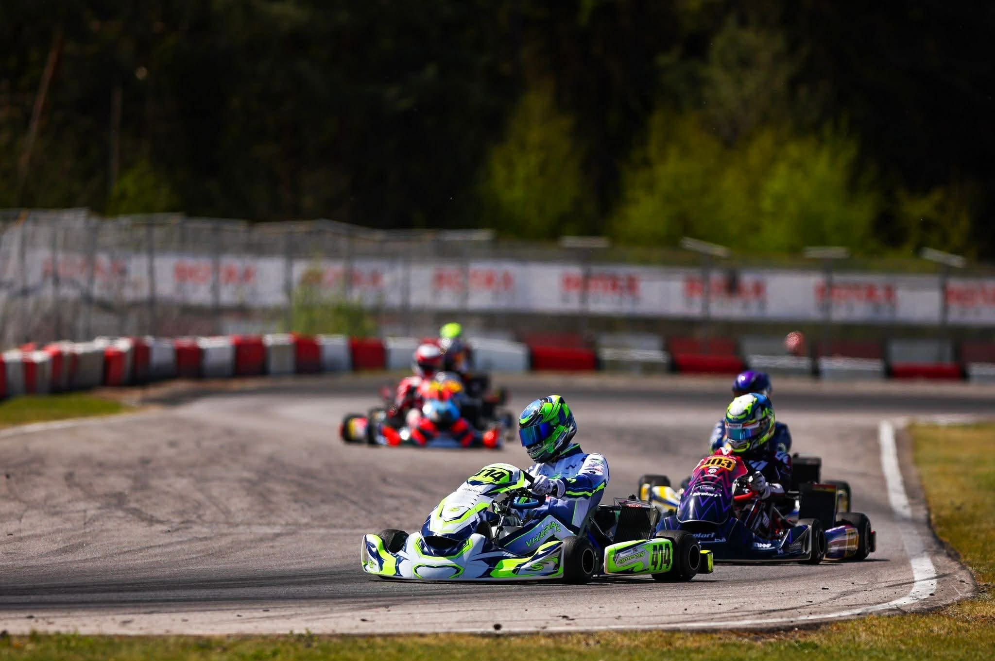 Synergy kart number 414 leads a group through a corner at the Rotax Euro Trophy